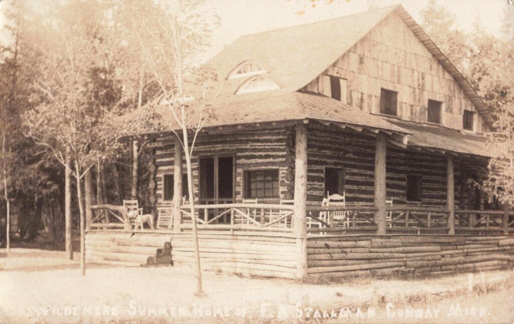 Log Cabin In Wooded Area.