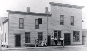 Historic Wooden Building With People Outside