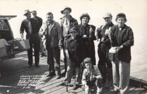 Group Of People On A Dock.