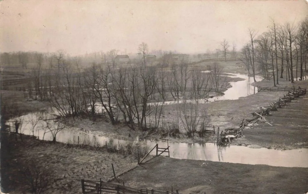 History Of Blissfield Michigan - Raisin River Landscape With Bare Trees.