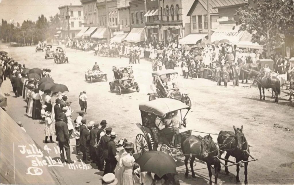 Downtown Shelby Street Scenes – Horse-Drawn Wagons Alongside Early Autos Place Photos Between 1905–1925.