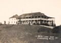 Historic Inn On A Grassy Hill.