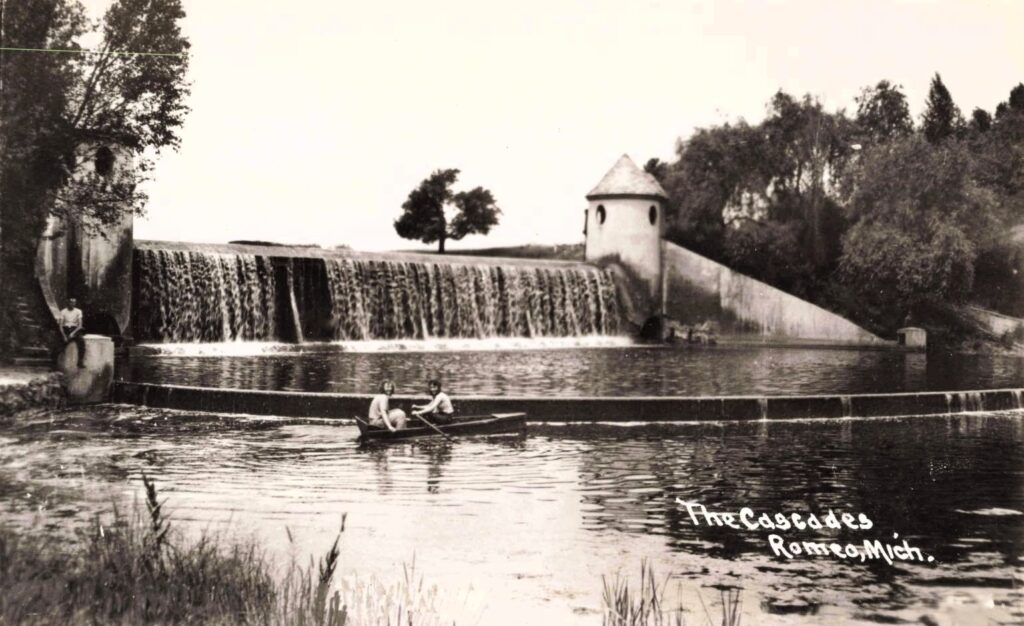 Historic Dam With People In Boat