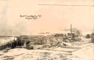 Historic Lumber Mill In Snowy Landscape.
