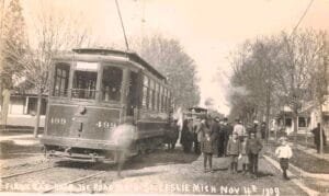 Early Electric Streetcar In Leslie Michigan Surrounded By Residents During Its First Run In 1909.