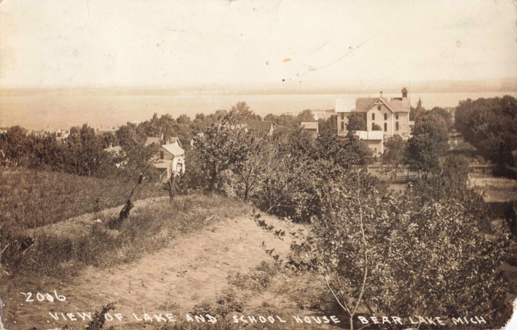 History Of Bear Lake Michigan -View Of Lake And School House, Bear Lake, Mich., C.1906. The School Stood Above The Shoreline, Serving Families Tied To The Logging Trade.