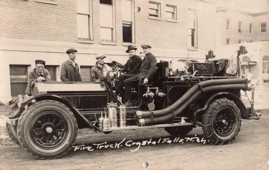 Vintage Fire Truck With Men Standing