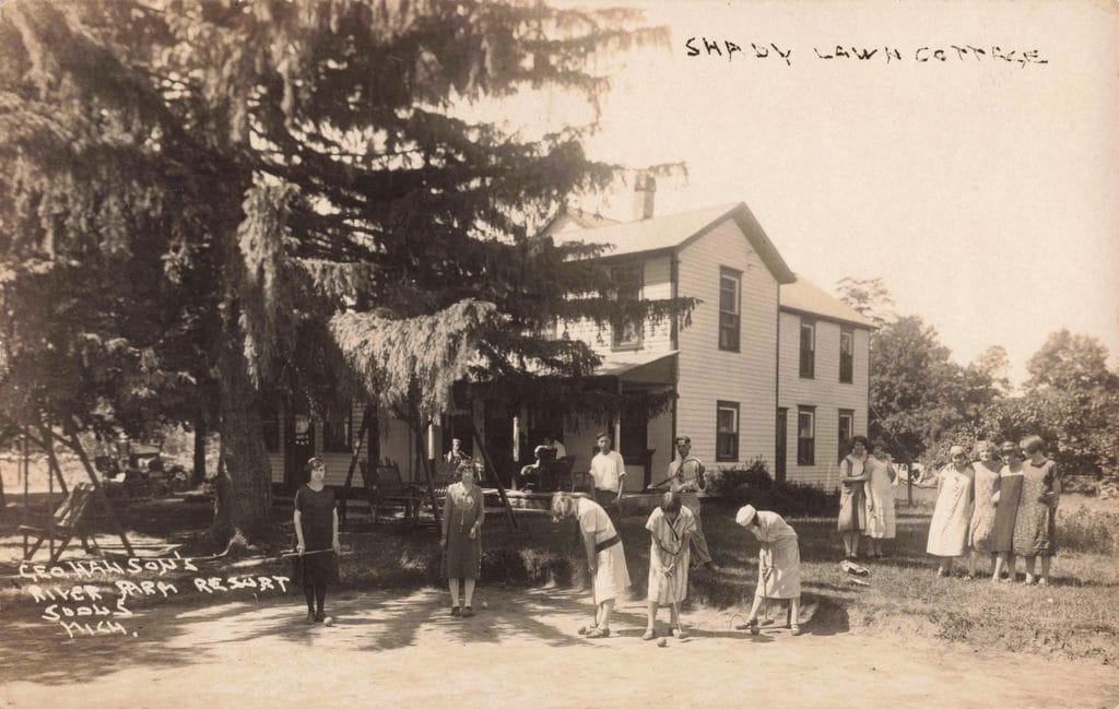 Historic Cottage With People Gathered Outside. - History Of Sodus Michigan
