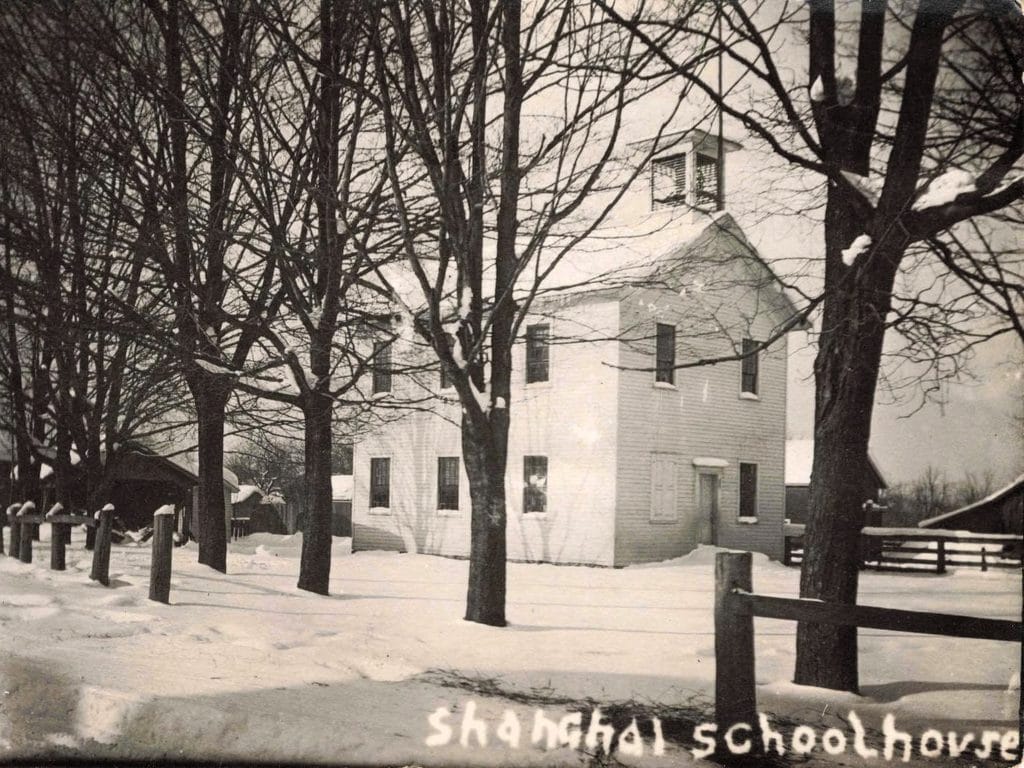 Historic Schoolhouse In Snowy Landscape