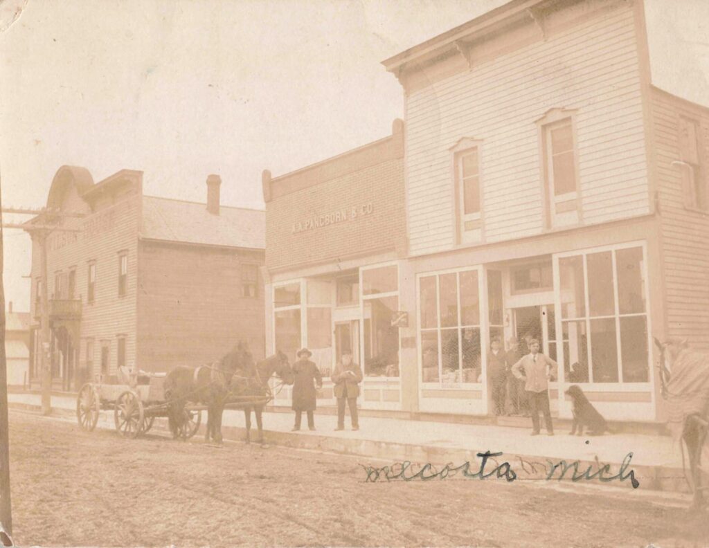 Historic Storefront With Horse-Drawn Carriage