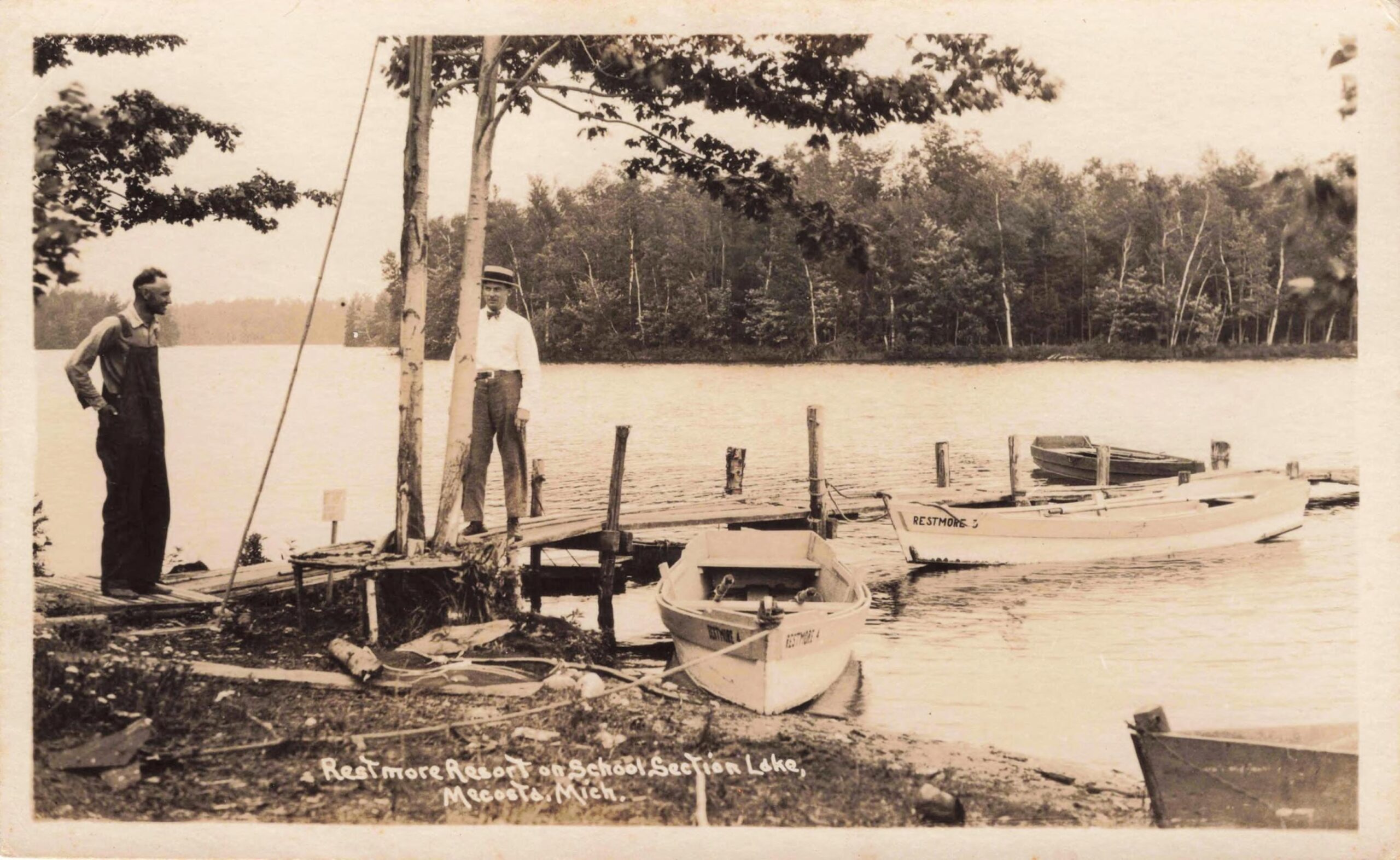 Restmore Resort On School Section Lake Near Mecosta With Wooden Buildings, A Dock And Small Boats