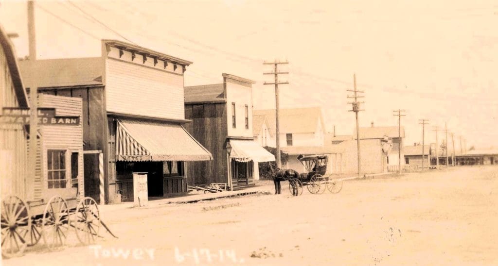 Historic Street With Horse-Drawn Carriage.