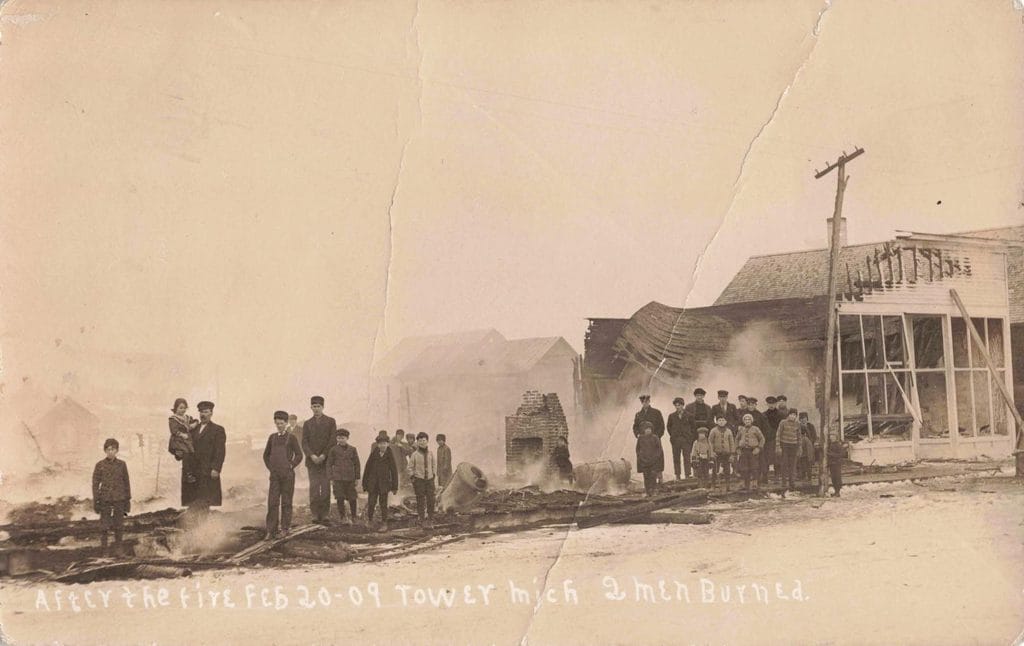 Post-Fire Scene With People Standing.