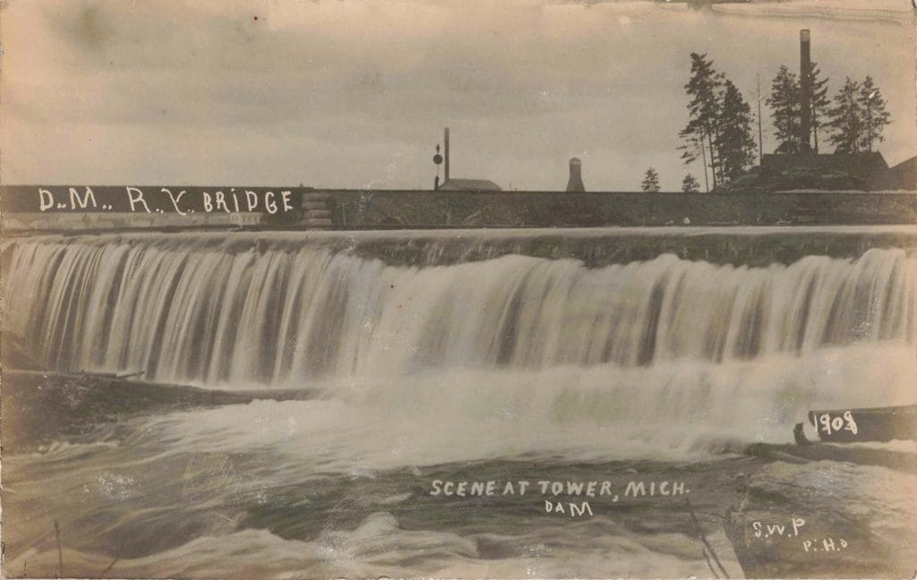 Historic Dam And Bridge Scene.